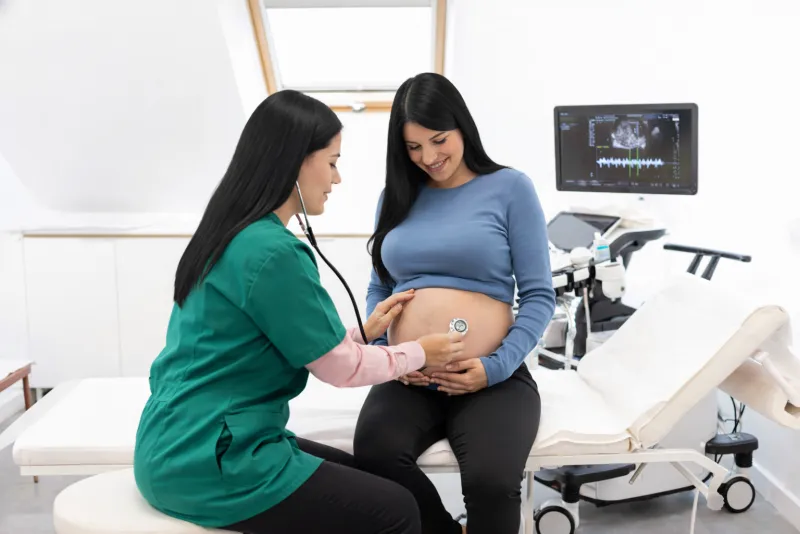 Pregnant woman receiving antenatal care checkup
